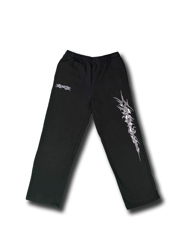 Front view of the Redeye Essentials Sweatpants in black featuring chrome tribal-style leg graphic and small chrome Redeye logo on the upper 